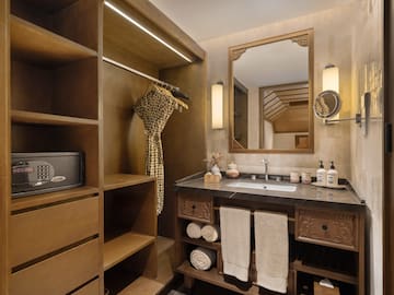 a bathroom with a mirror and a sink