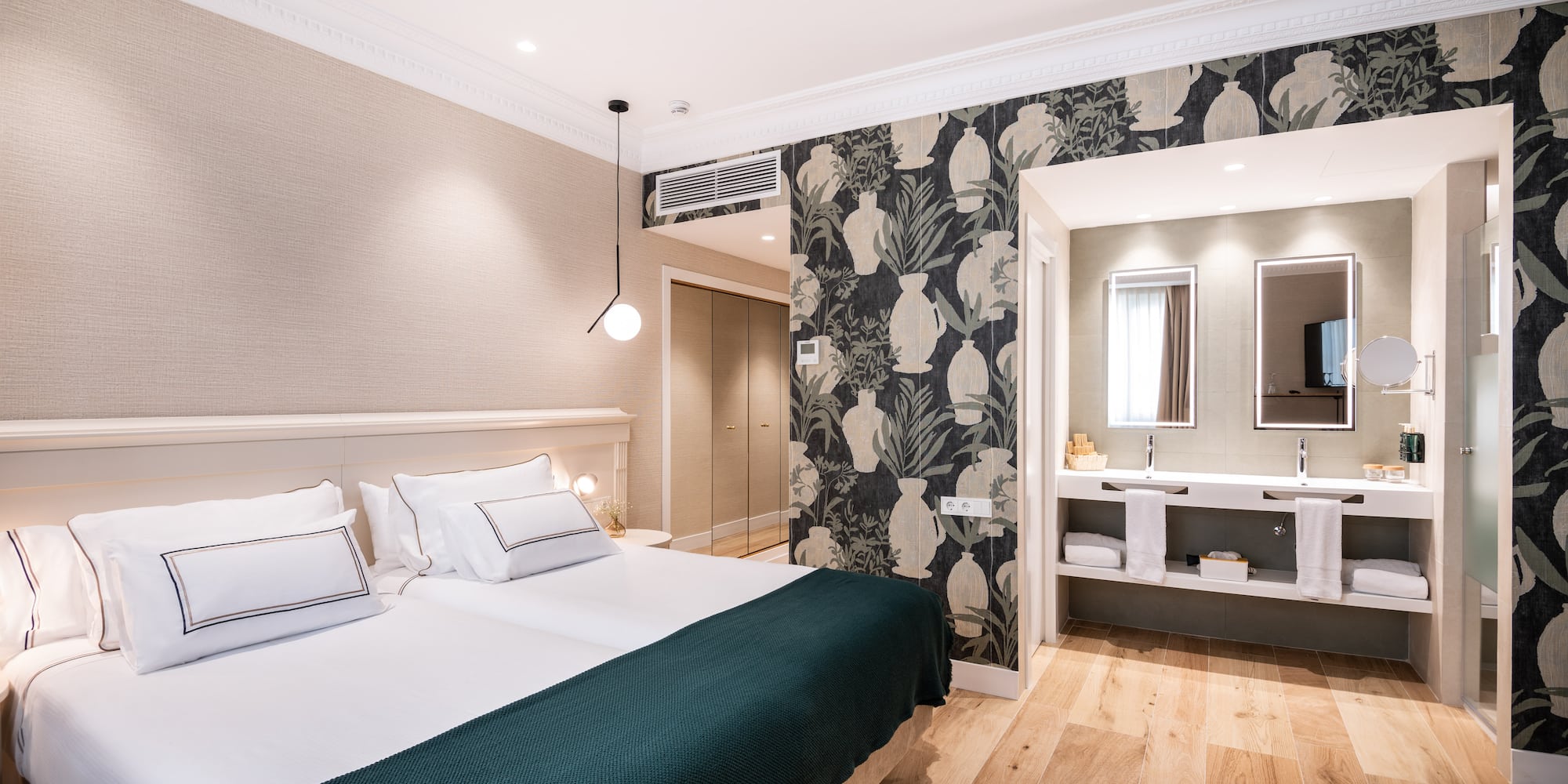 a bedroom with a bed and a mirror