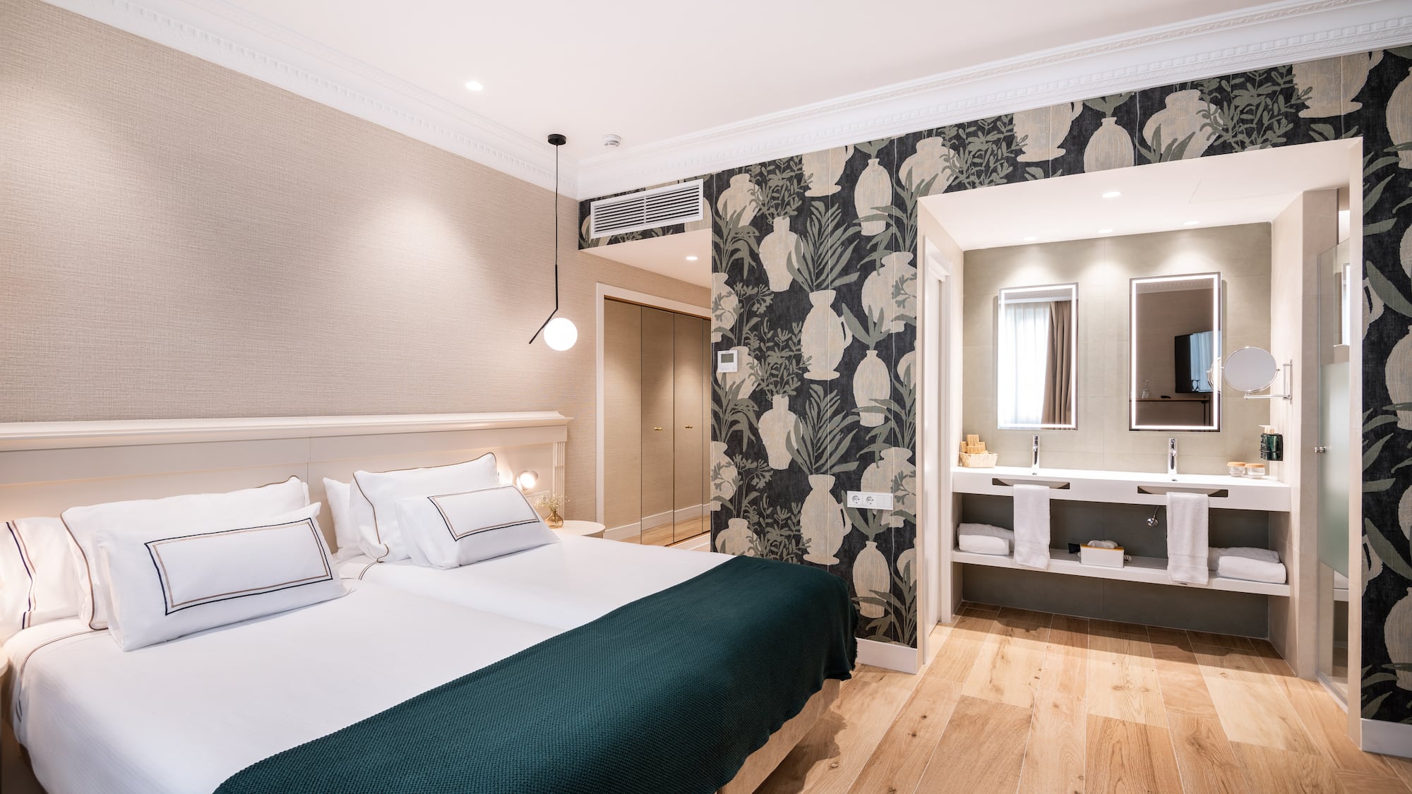 a bedroom with a bed and a mirror