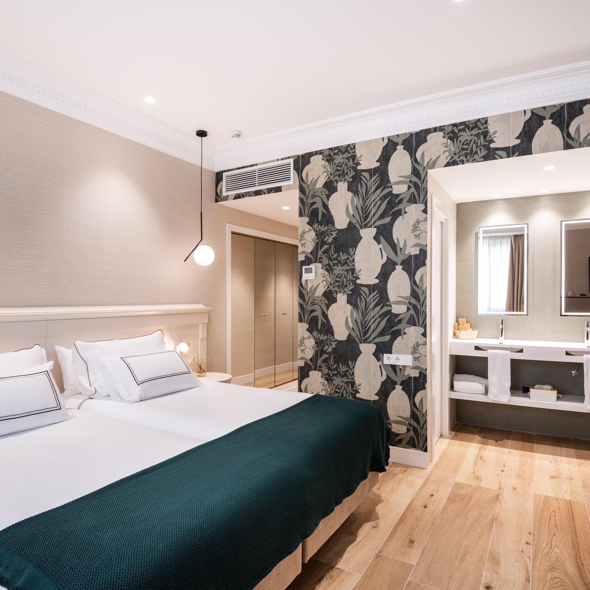 a bedroom with a bed and a mirror