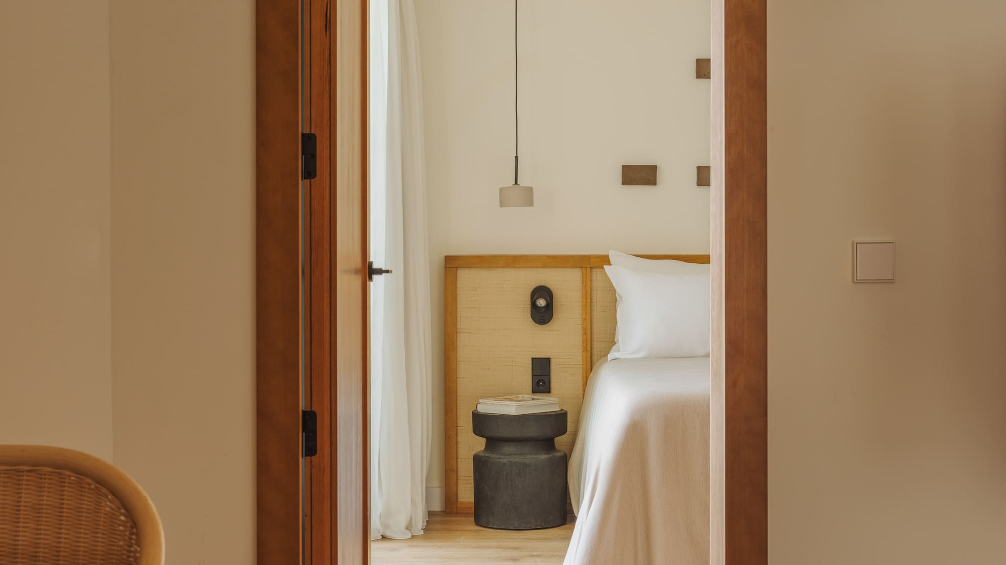 a room with a bed and a chair