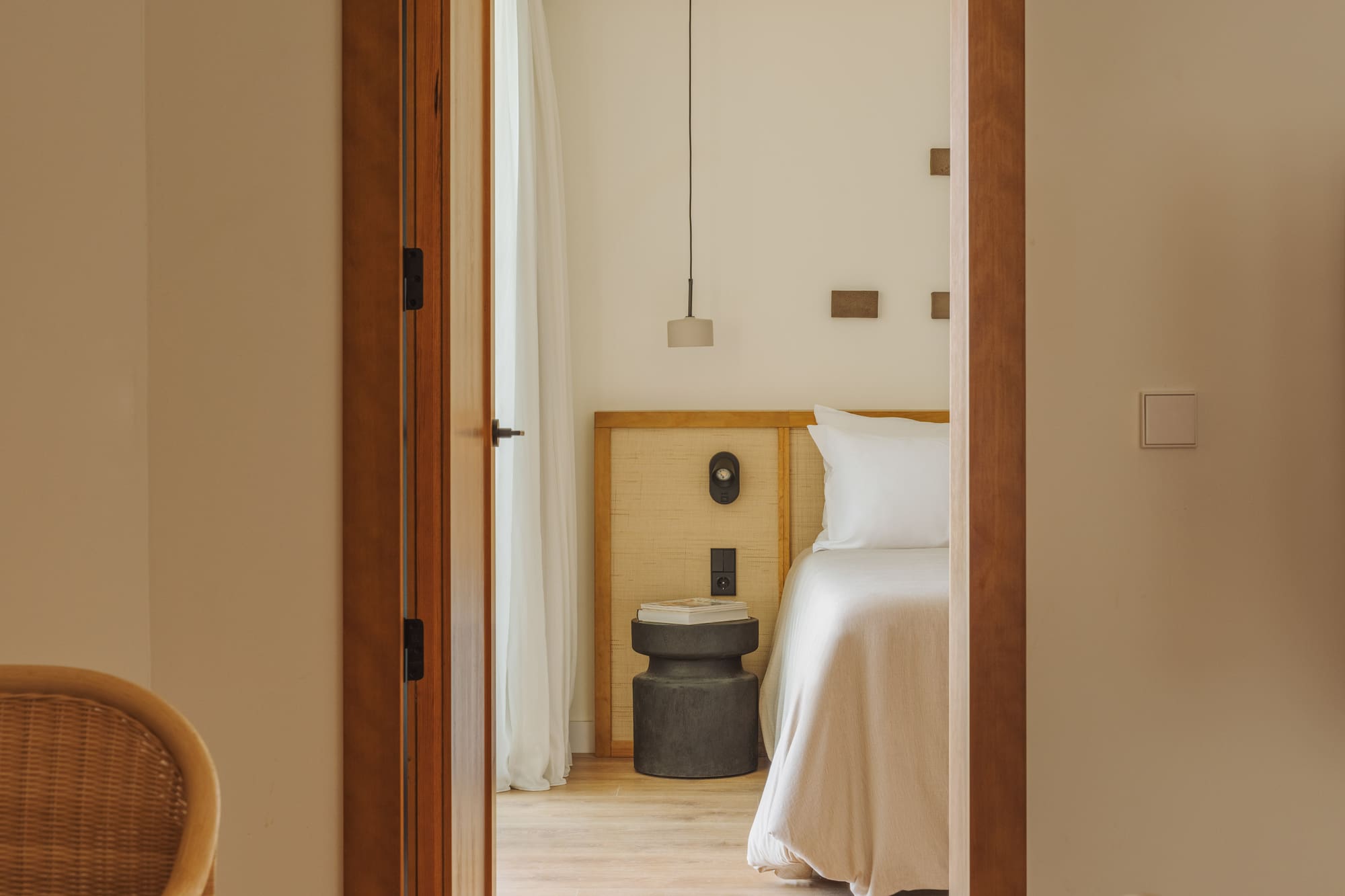 a room with a bed and a chair