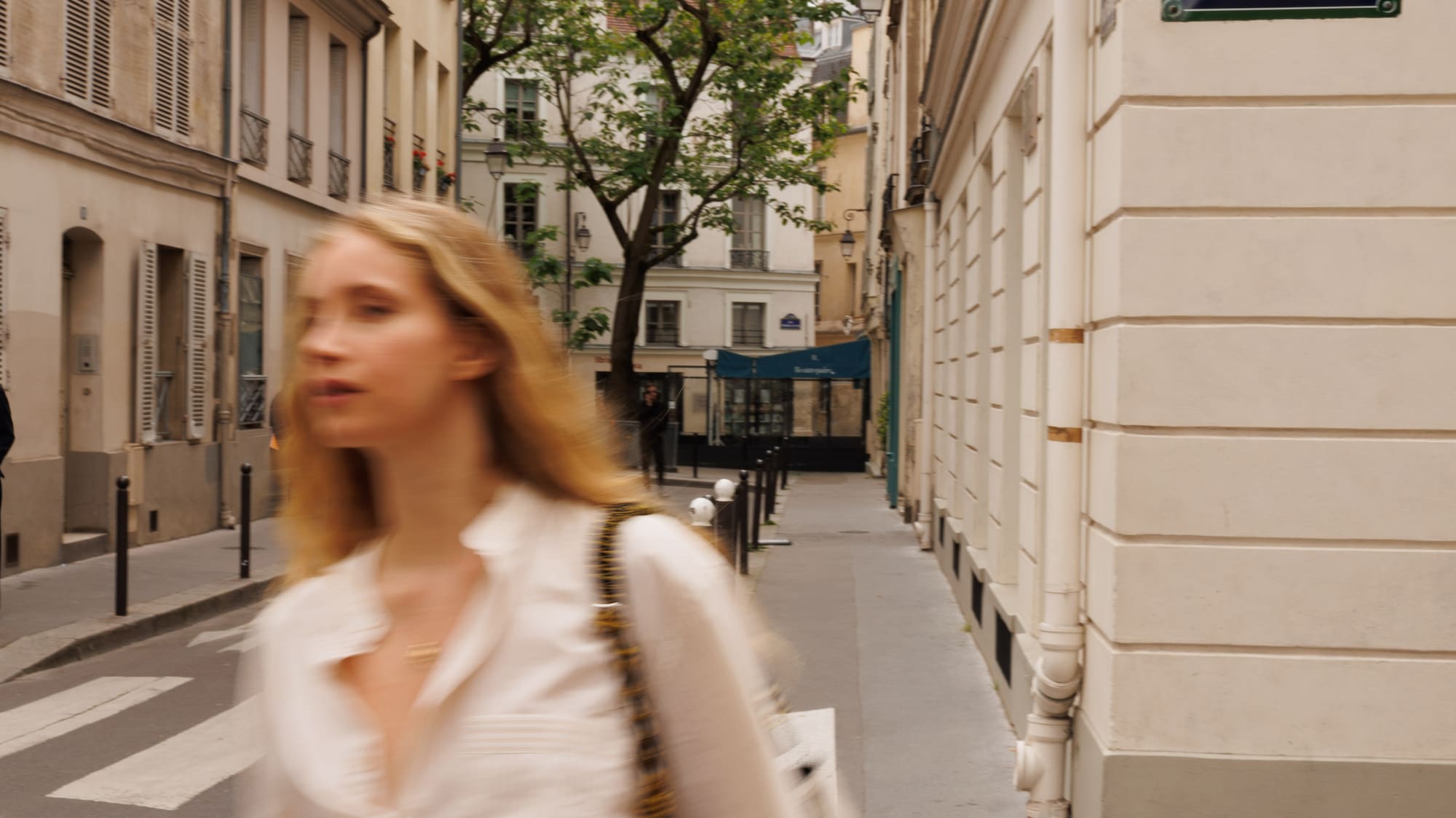 a woman walking down a street