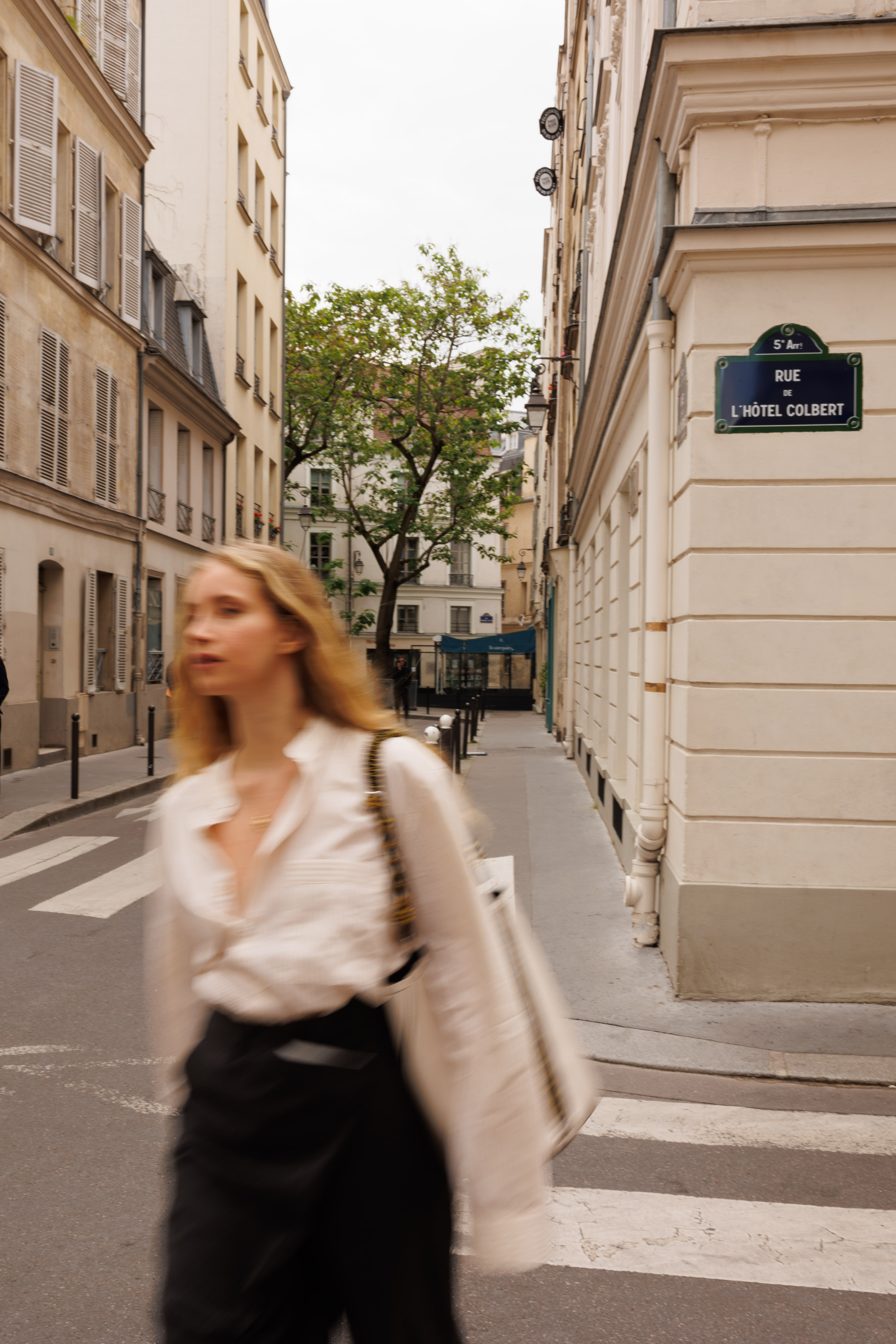 a woman walking down a street