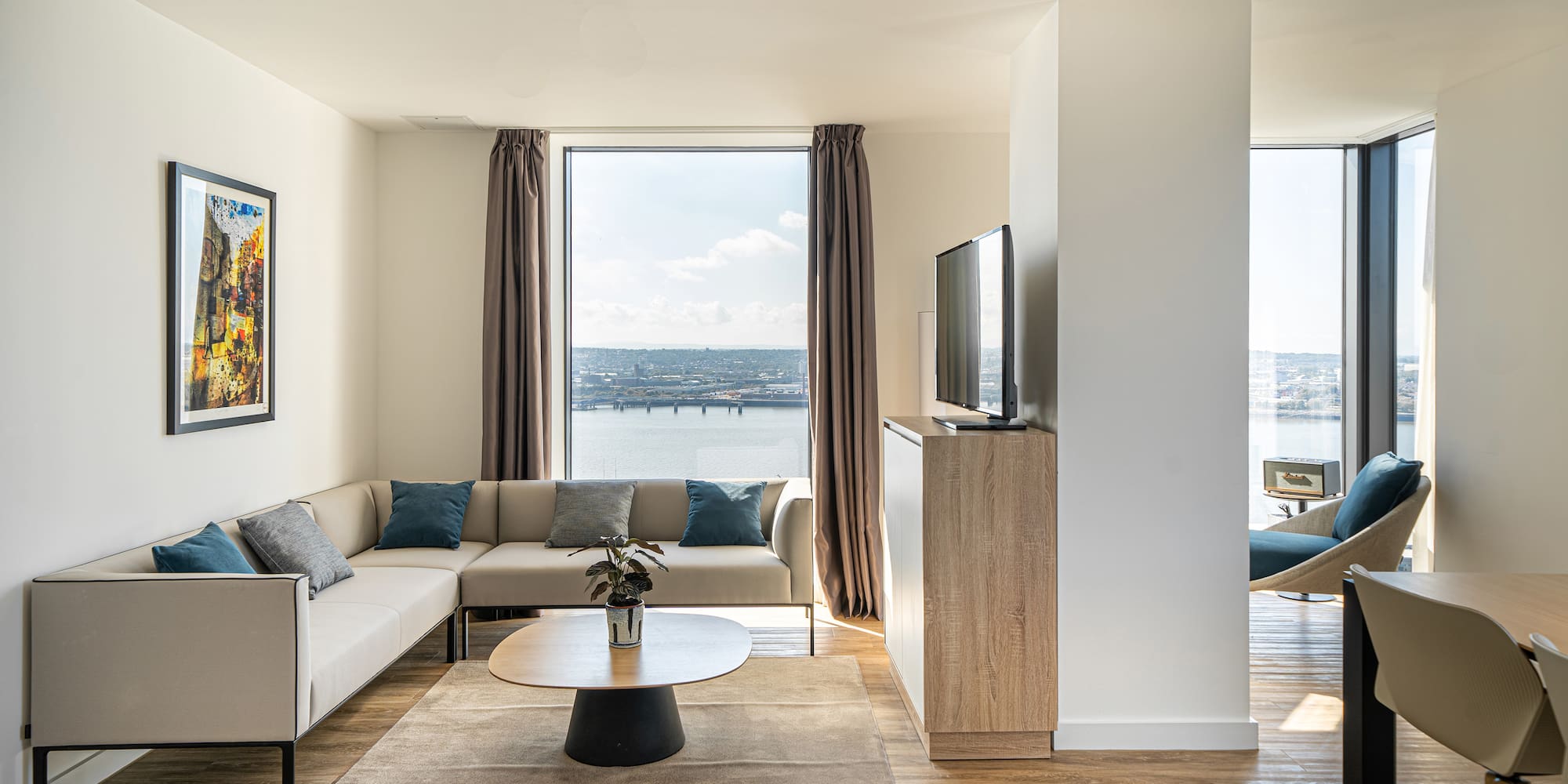 a living room with a couch and a television