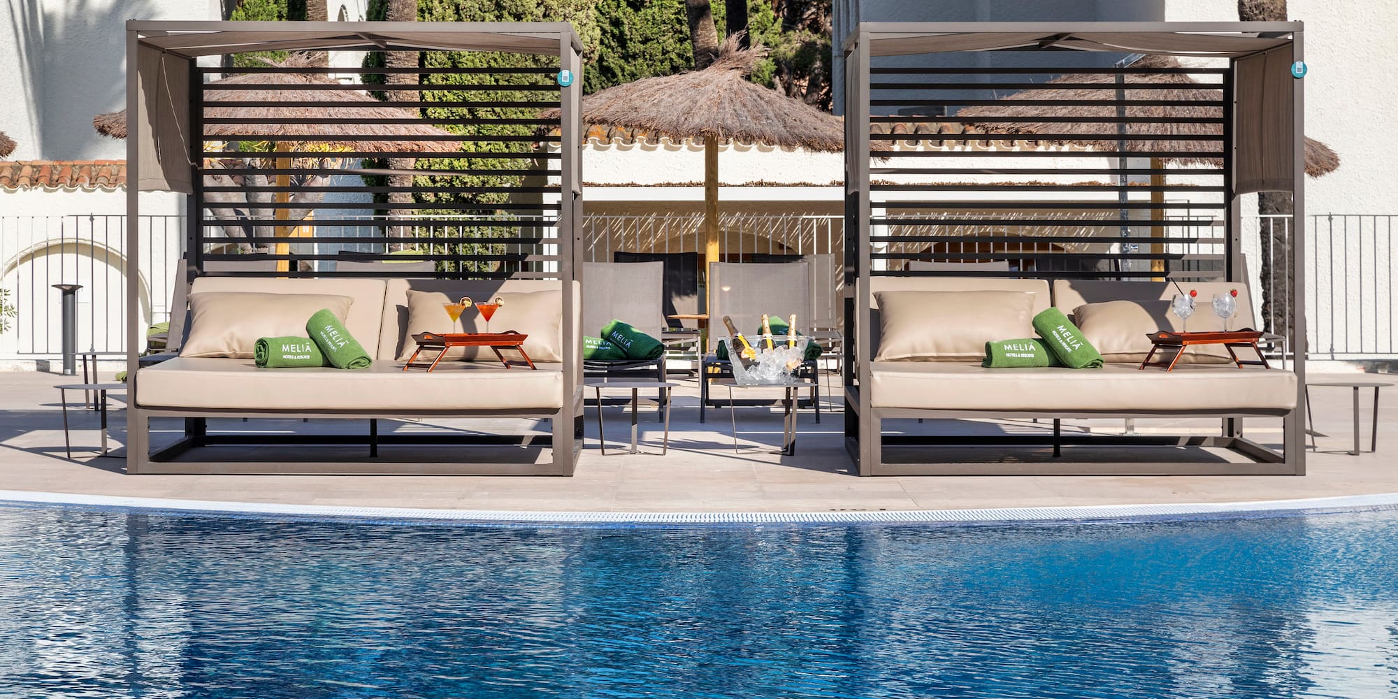 a pool with a lounge chair and a table