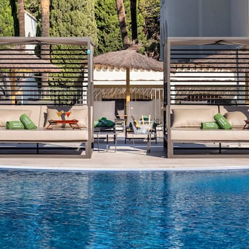 a pool with a lounge chair and a table