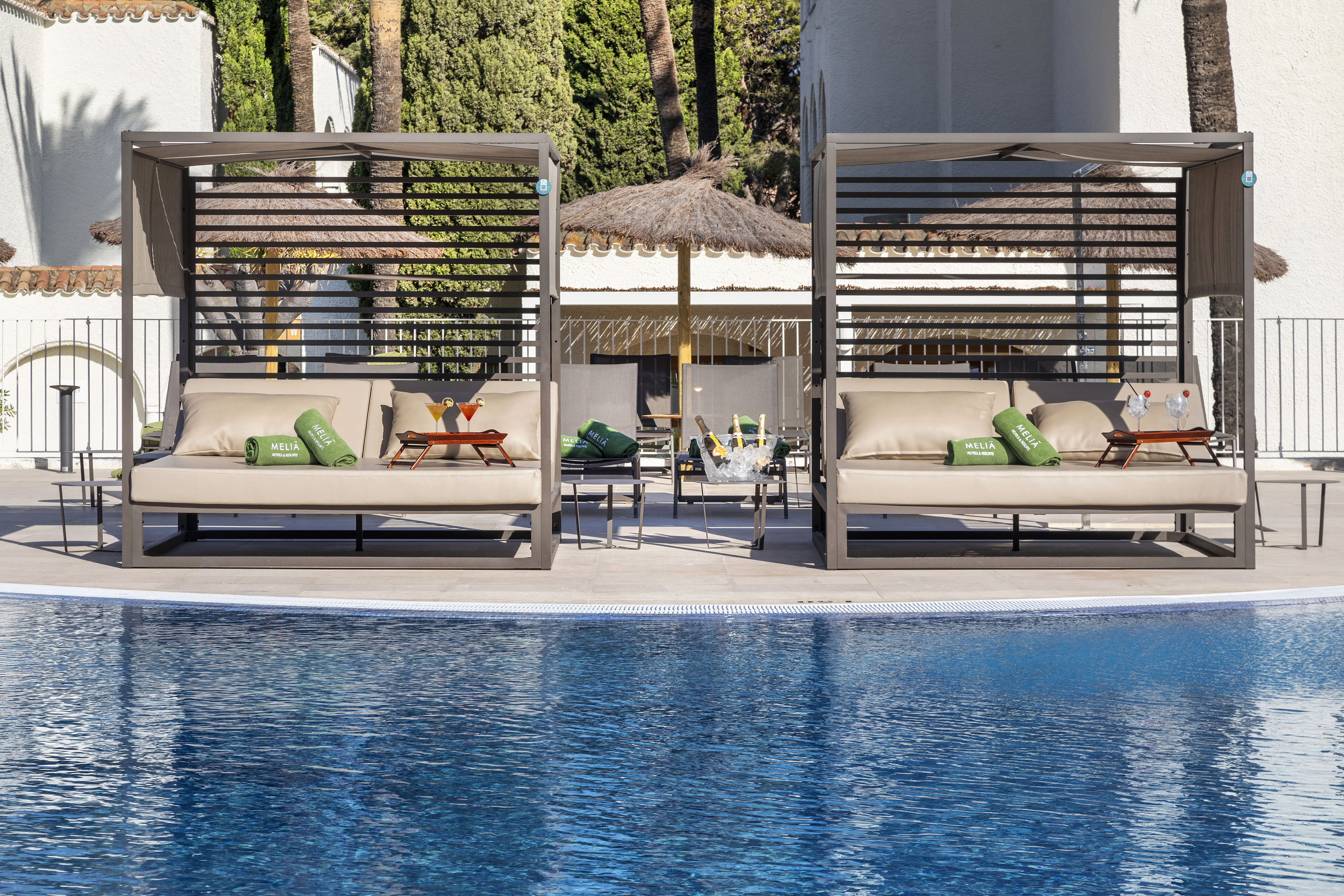 a pool with a lounge chair and a table