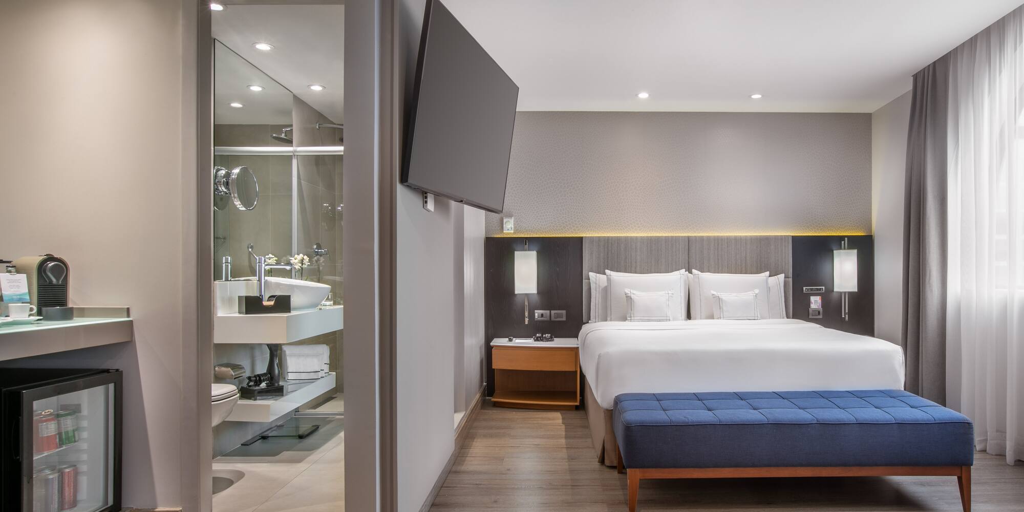 a room with a bed and a tv