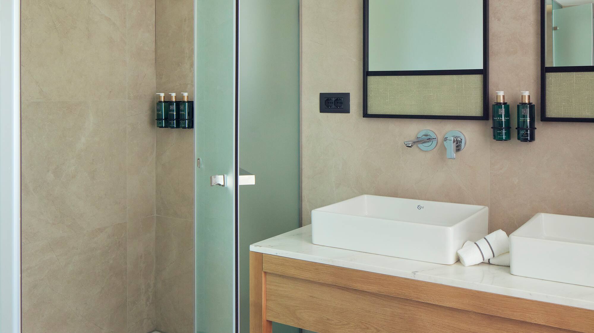 a bathroom with a shower and sink