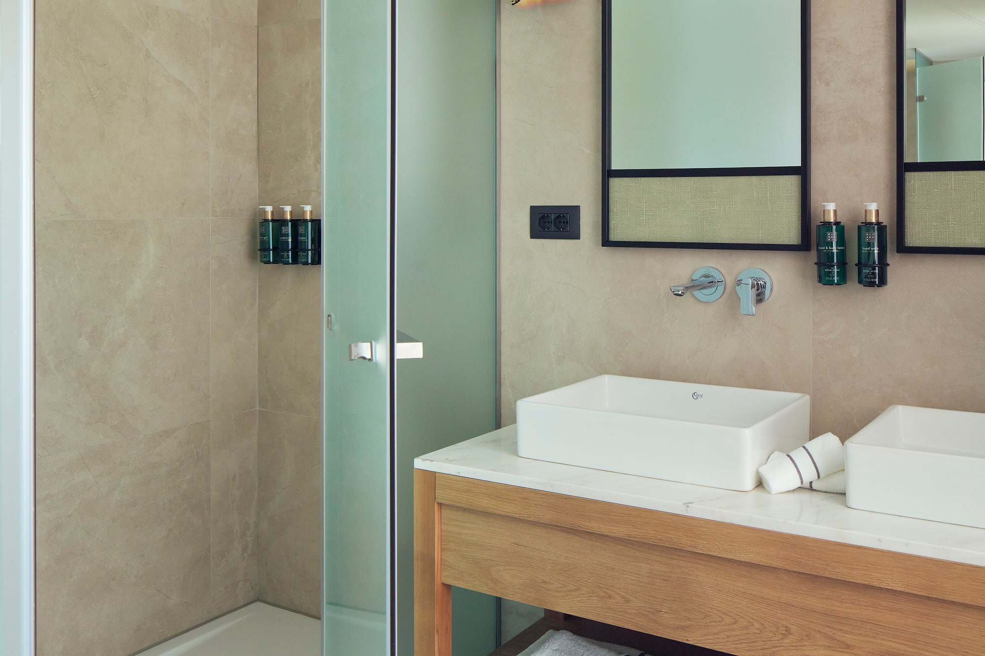 a bathroom with a shower and sink