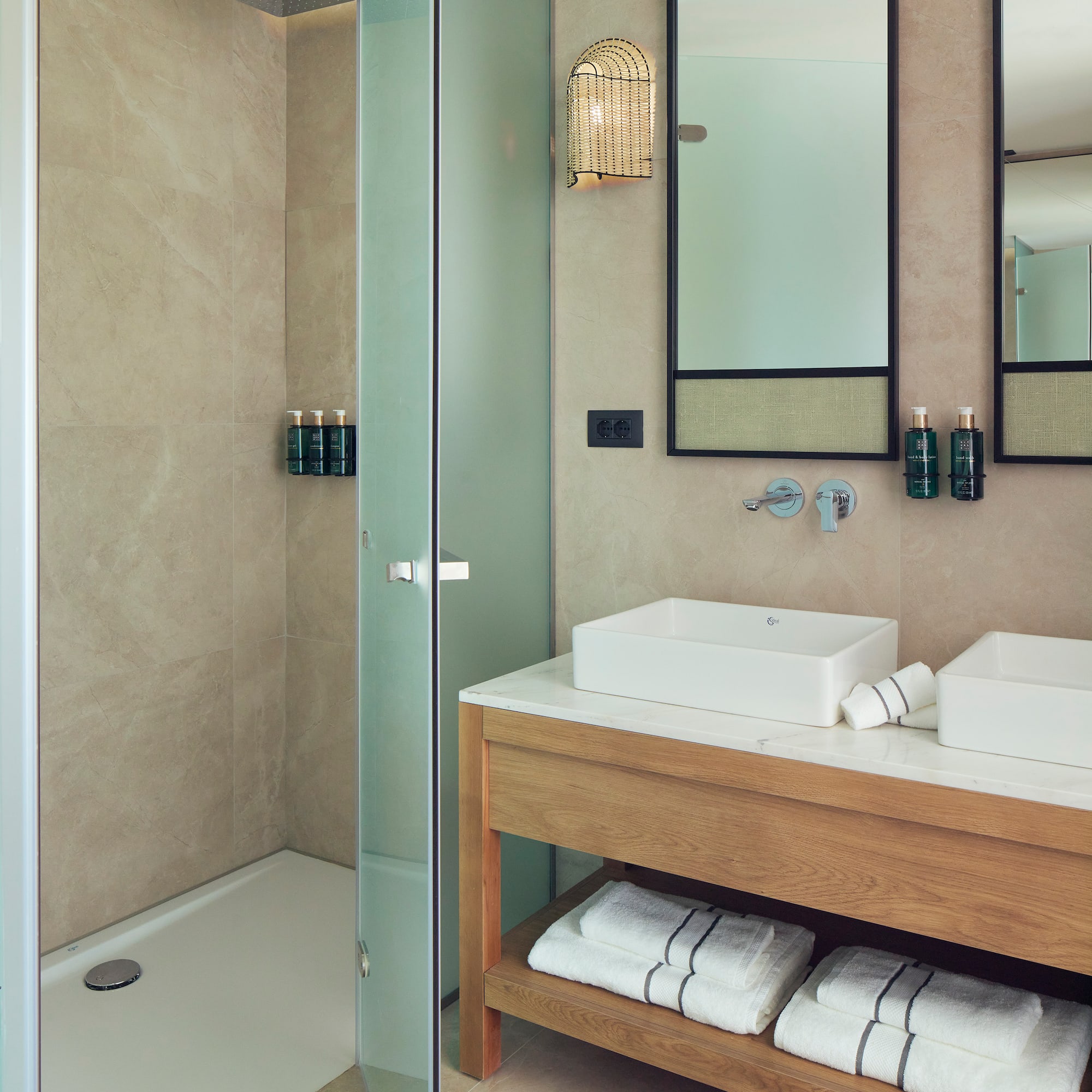 a bathroom with a shower and sink