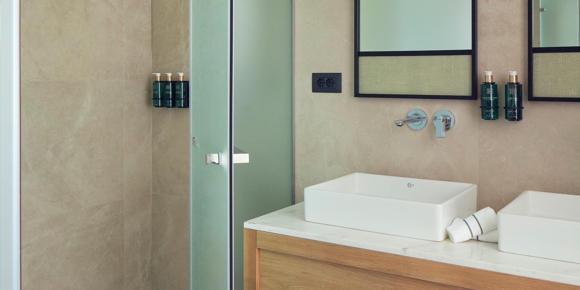 a bathroom with a shower and sink