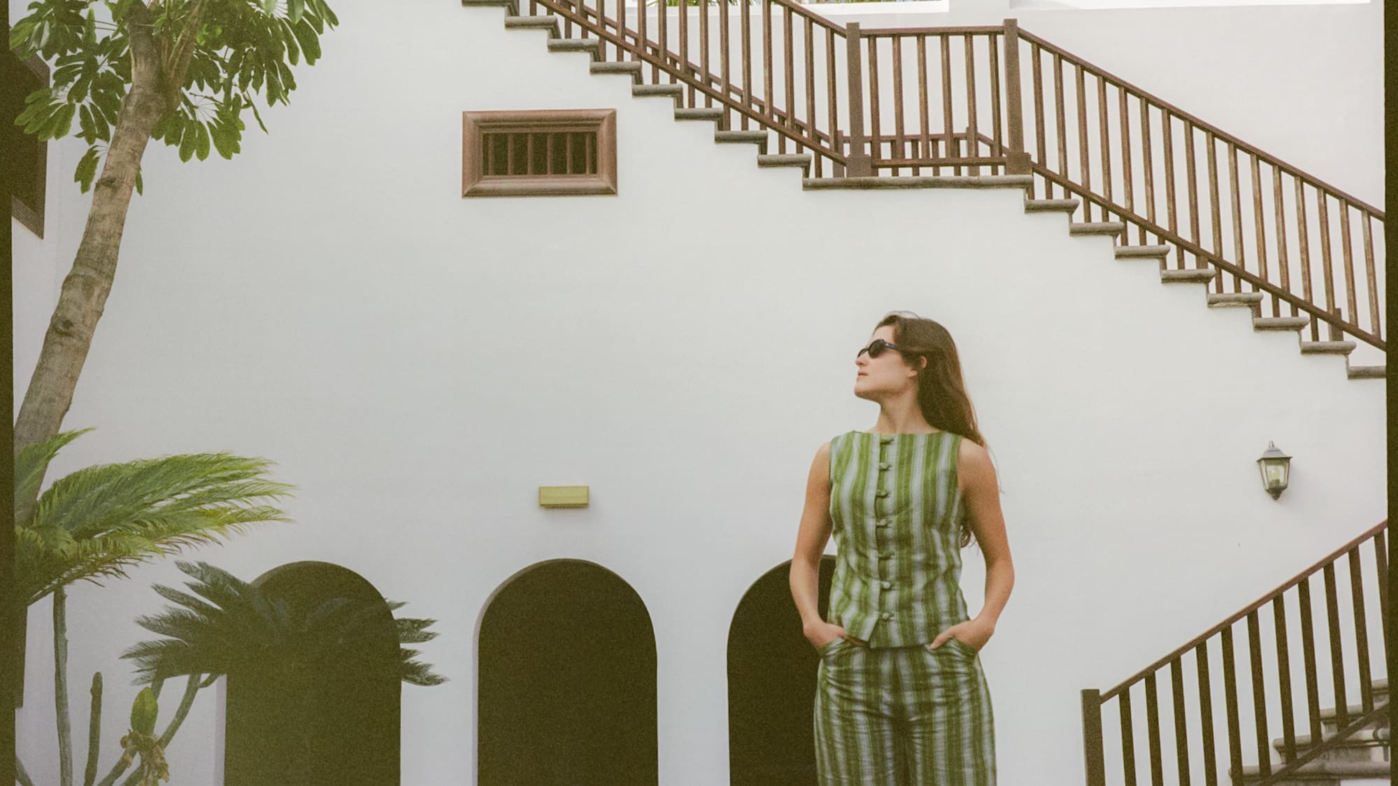 a woman standing in front of a building