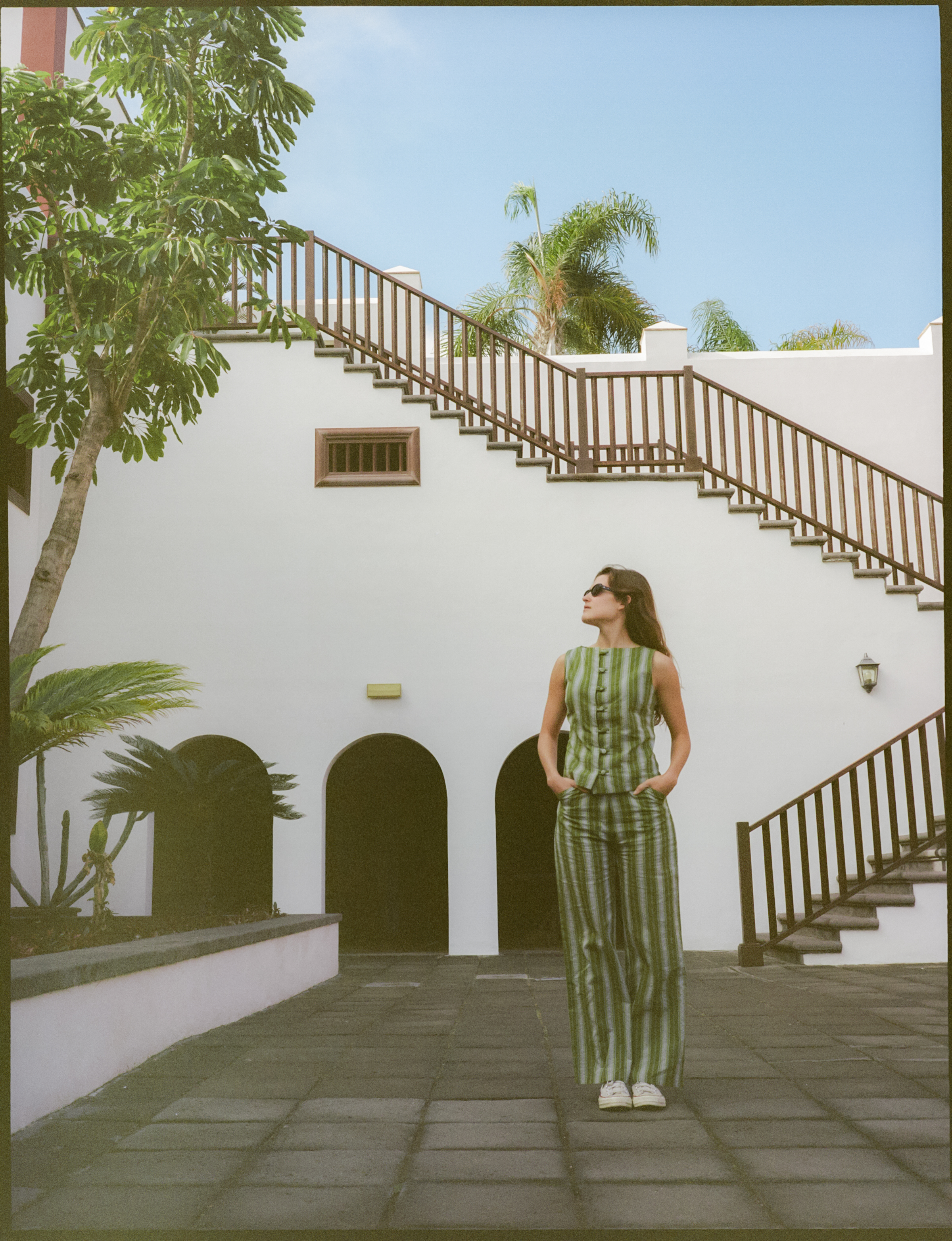 a woman standing in front of a building
