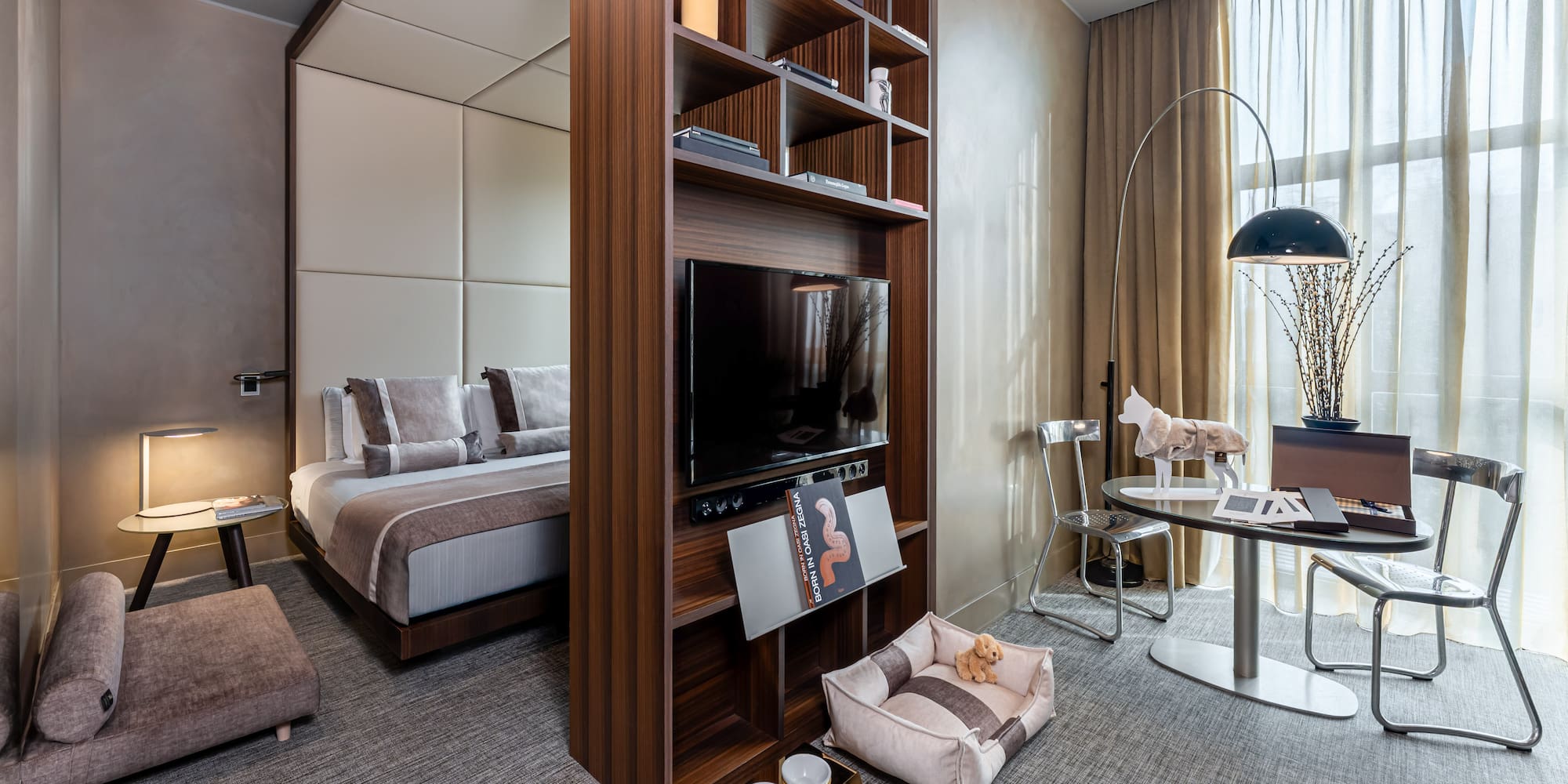 a room with a tv and a bed