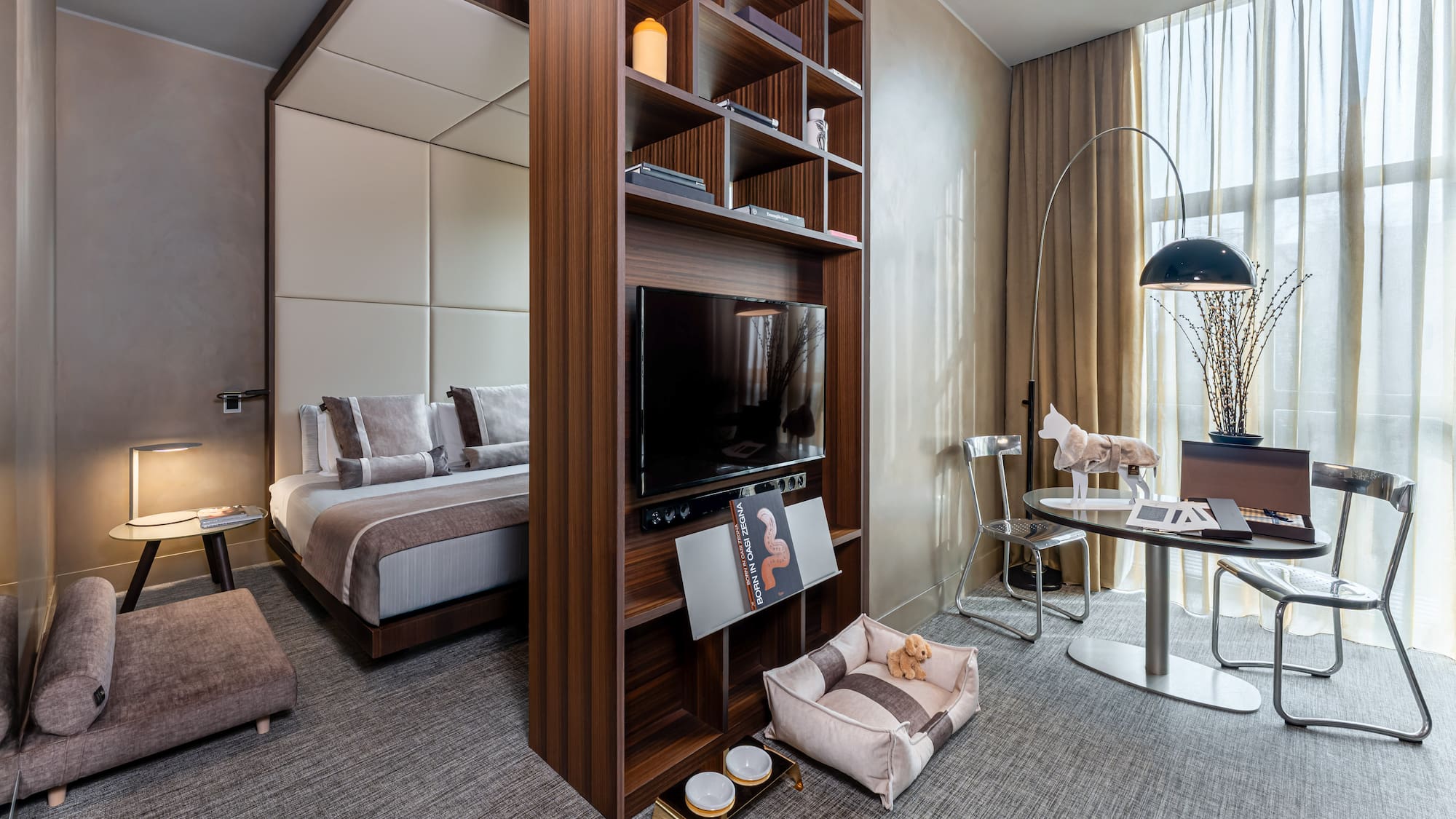 a room with a tv and a bed