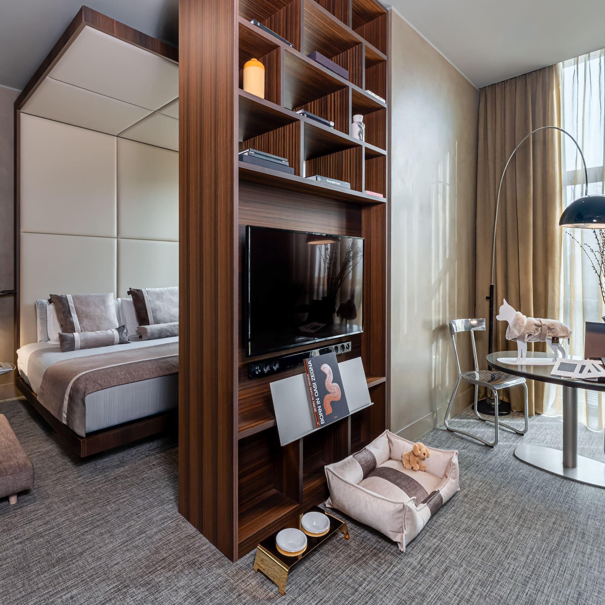 a room with a tv and a bed