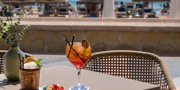 a glass of drink on a table