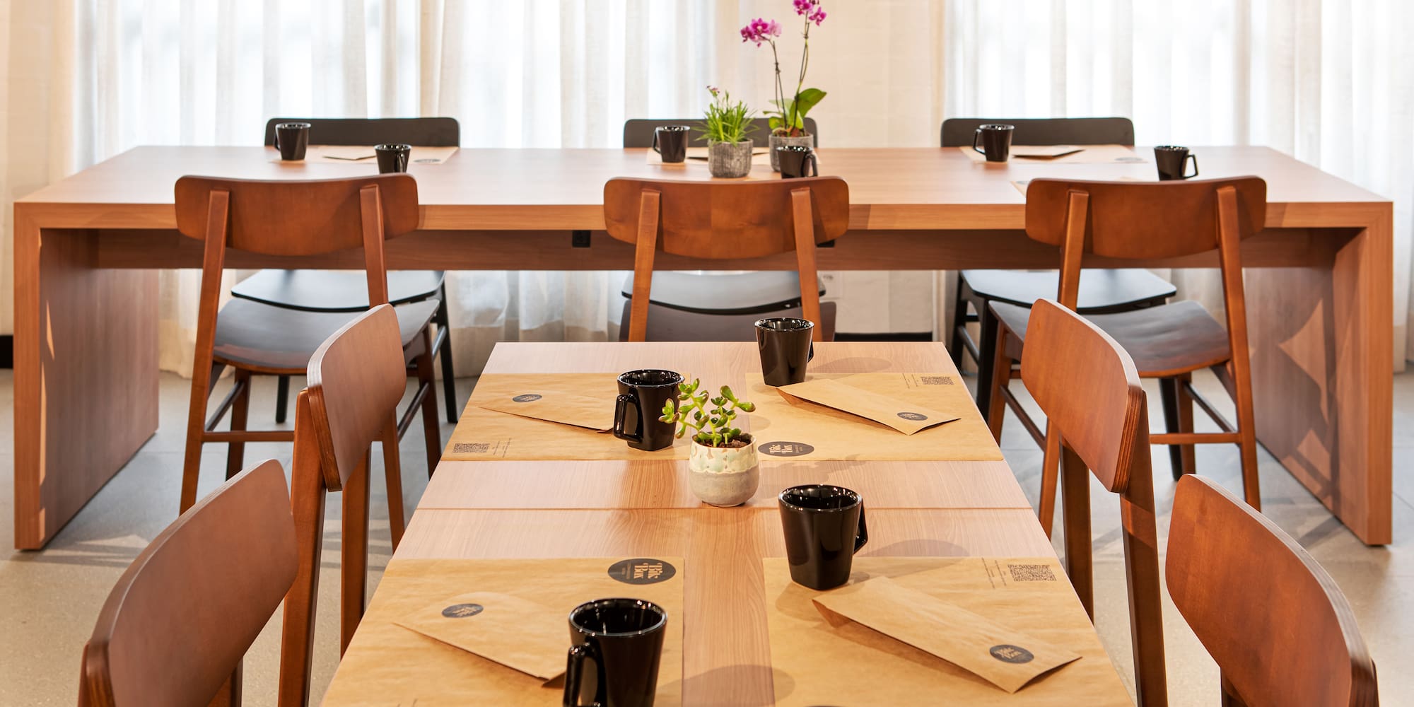 a table with black cups on it