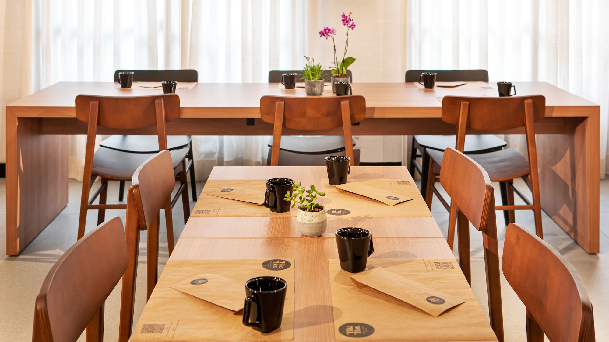 a table with black cups on it