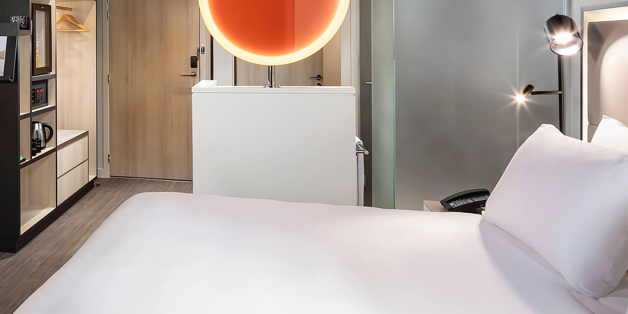 a room with a bed and a mirror