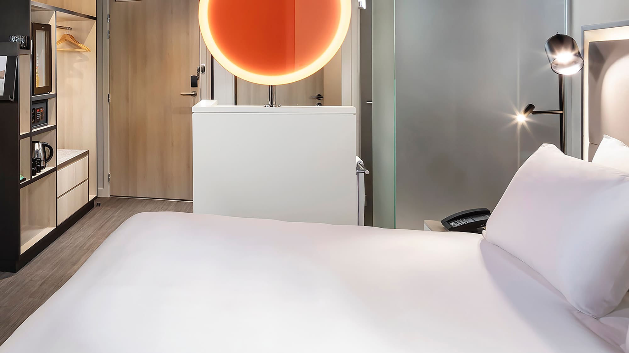 a room with a bed and a mirror