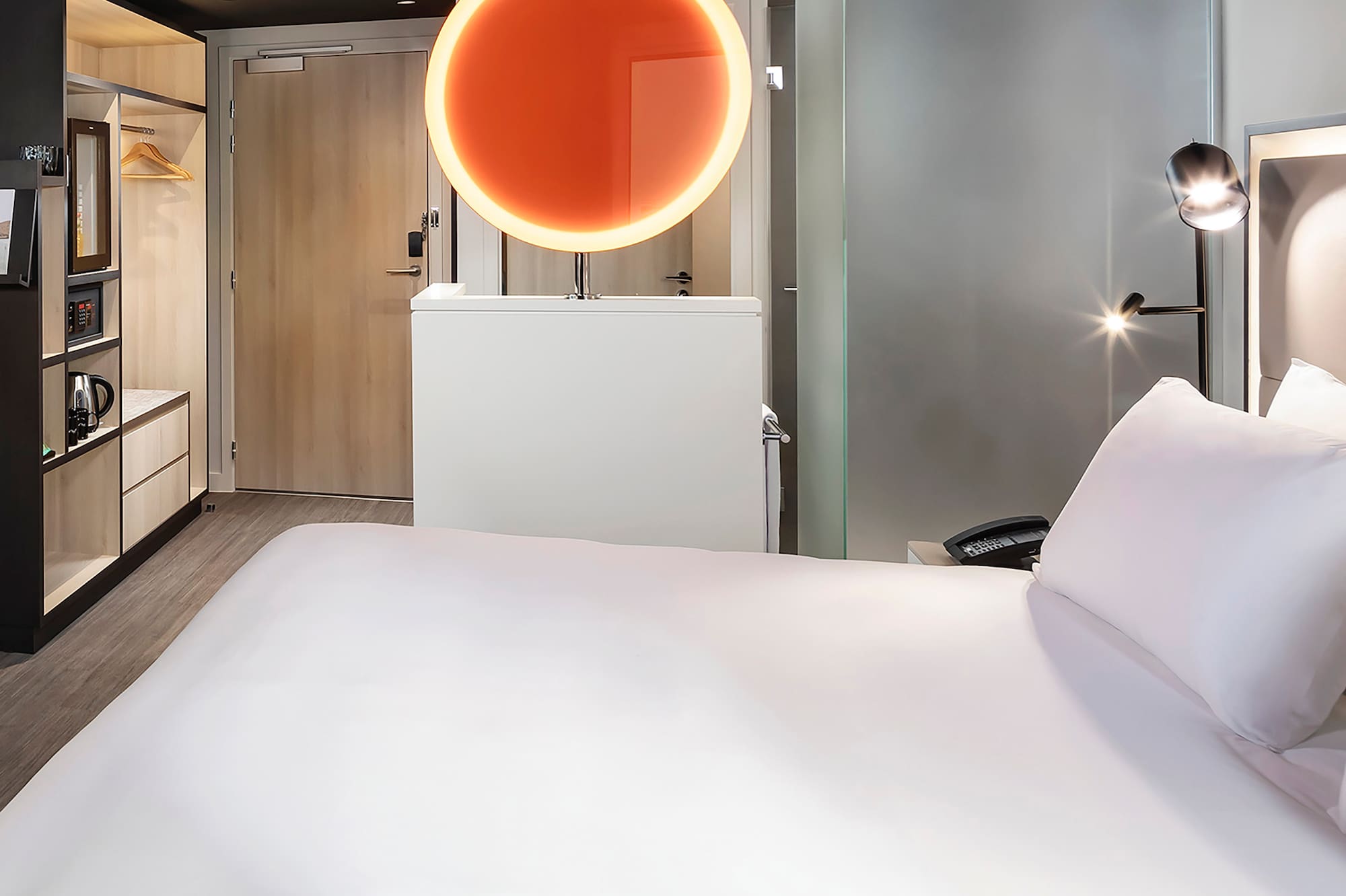 a room with a bed and a mirror