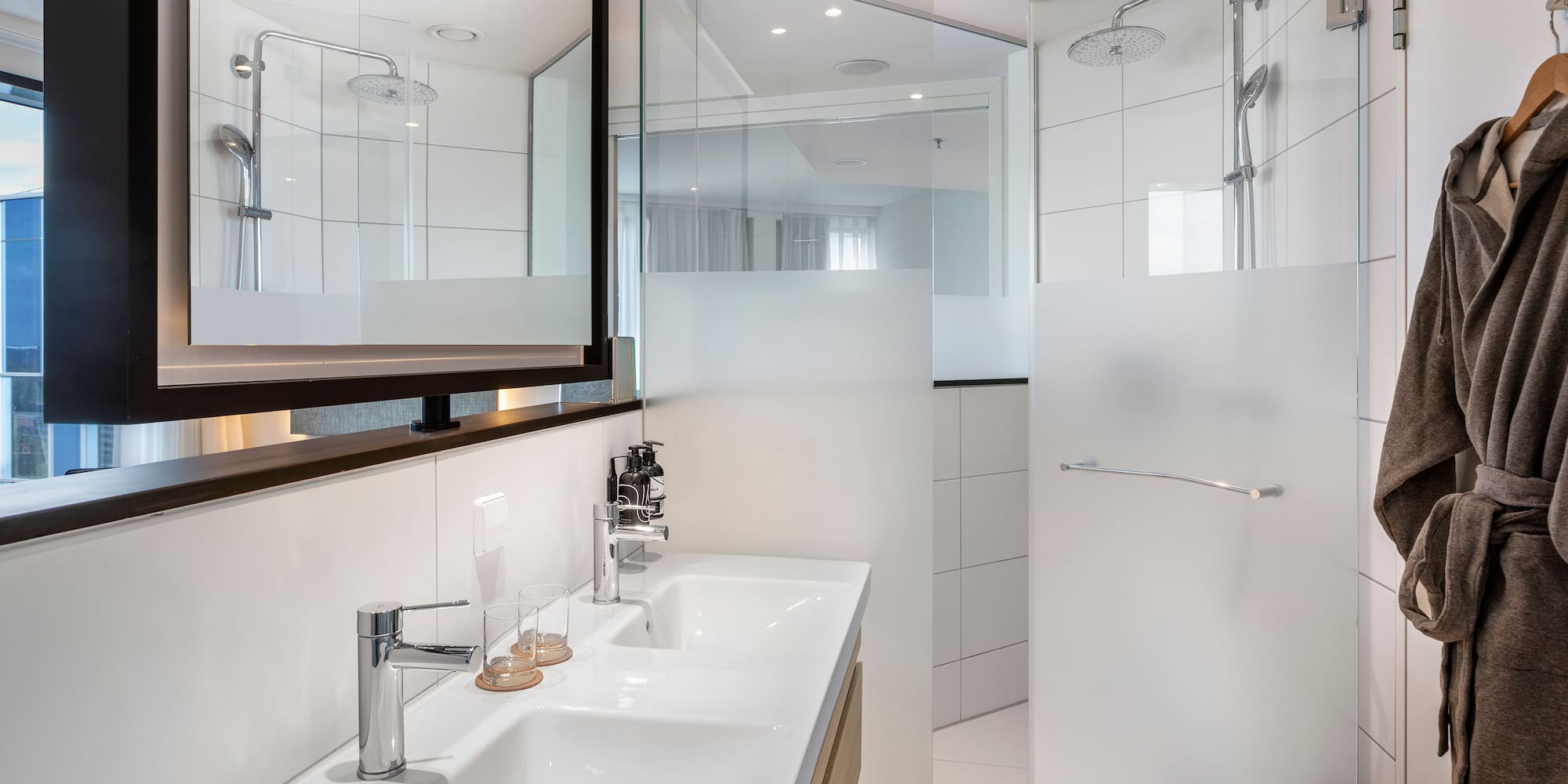 a bathroom with a shower and sink