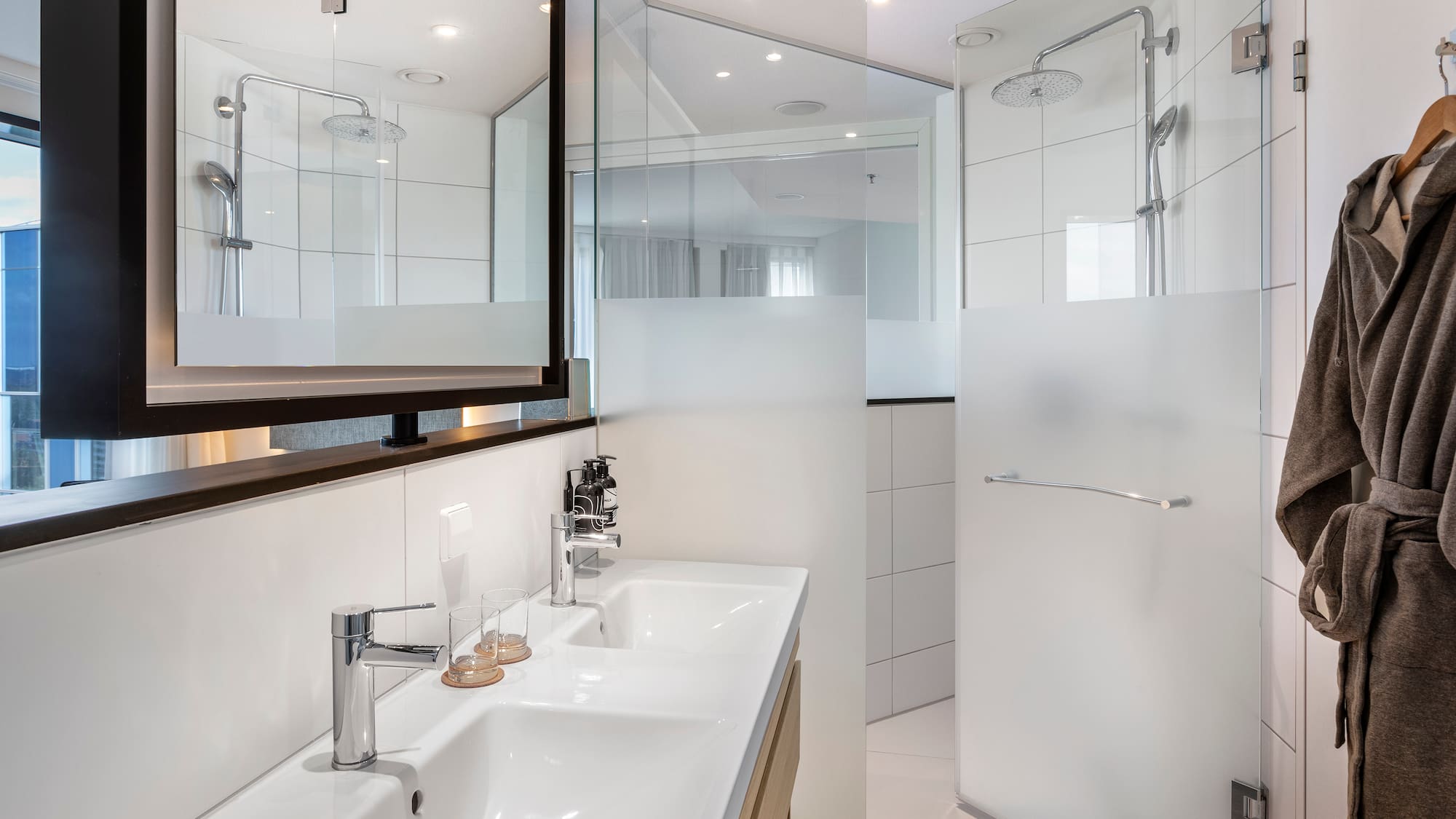 a bathroom with a shower and sink