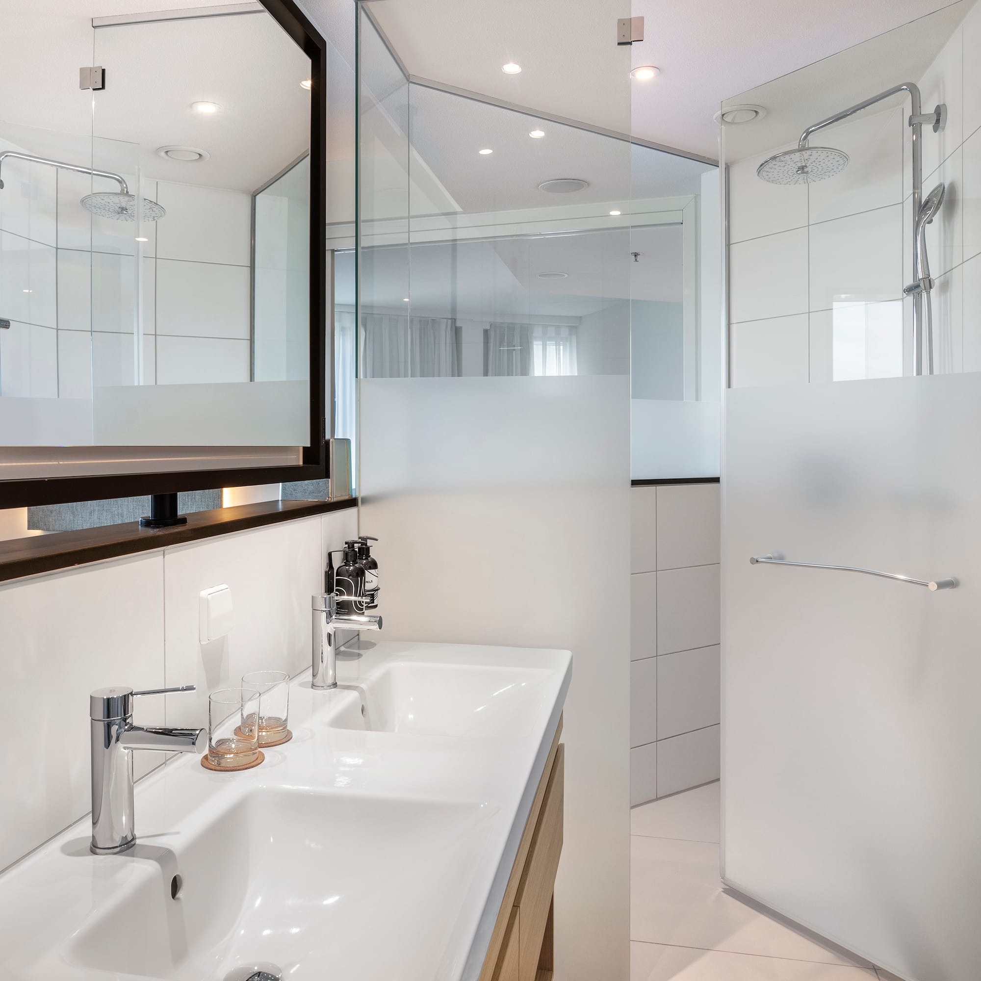 a bathroom with a shower and sink