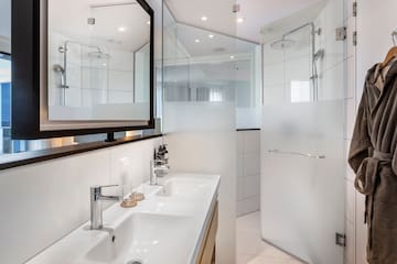 a bathroom with a shower and sink