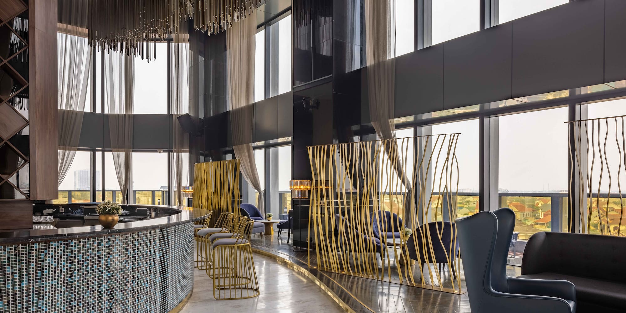 a room with a bar and chairs