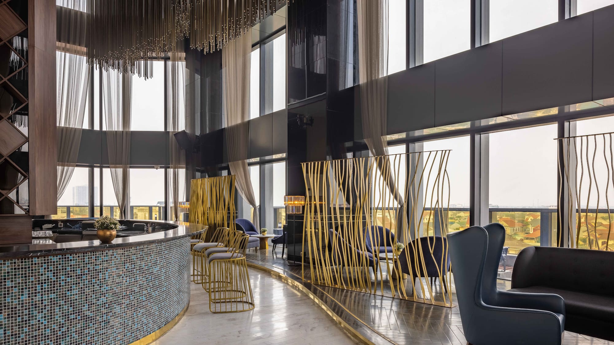 a room with a bar and chairs