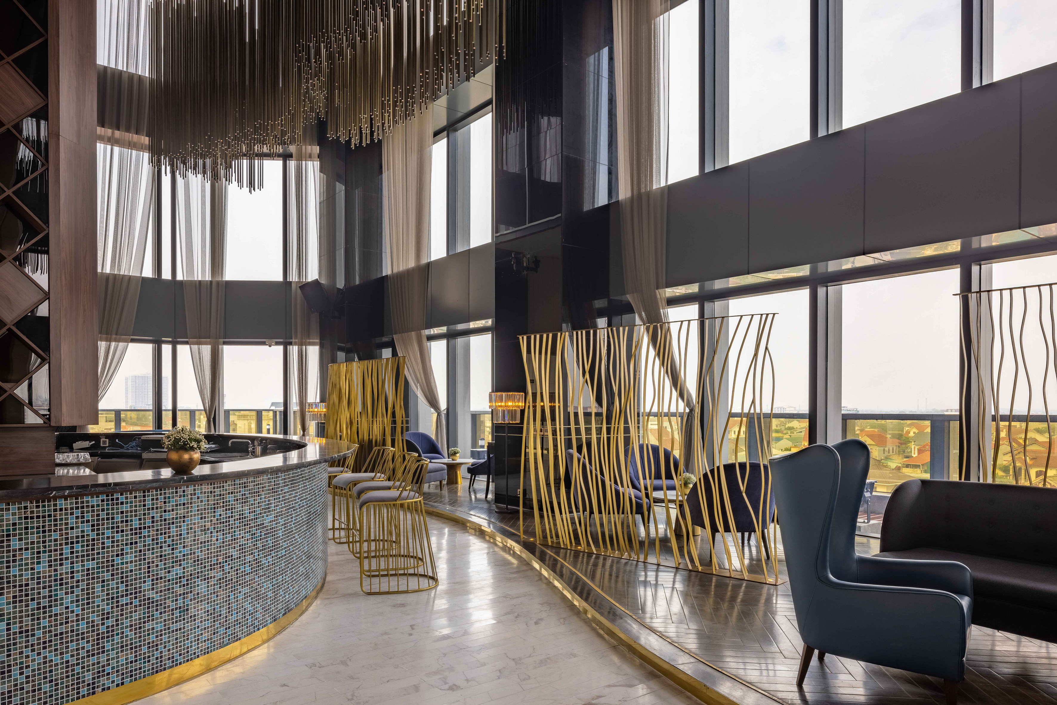 a room with a bar and chairs