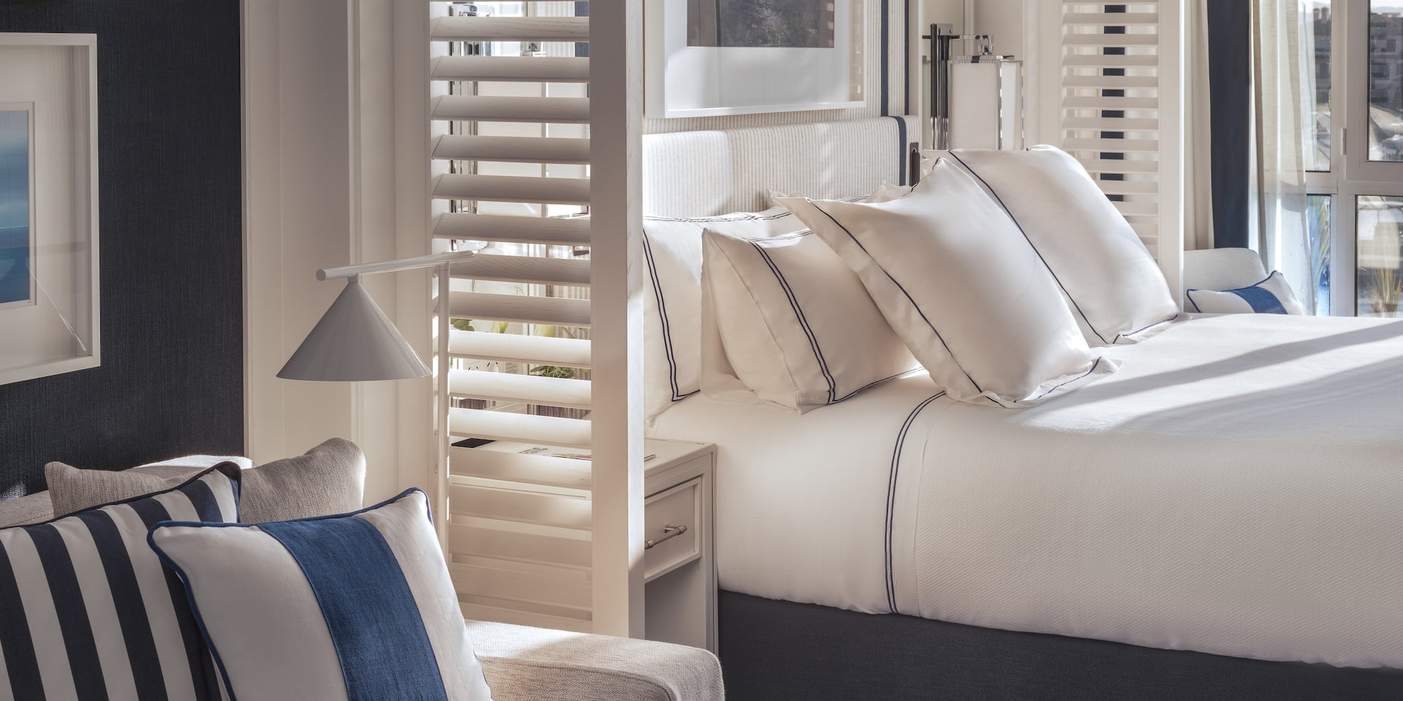 a room with a bed and a chair