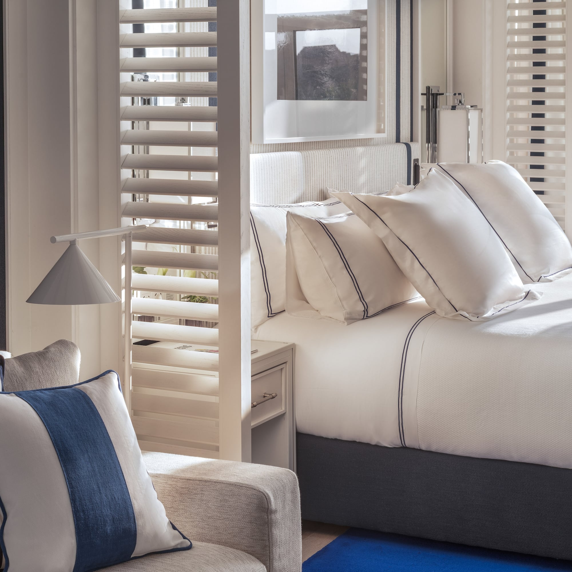 a room with a bed and a chair