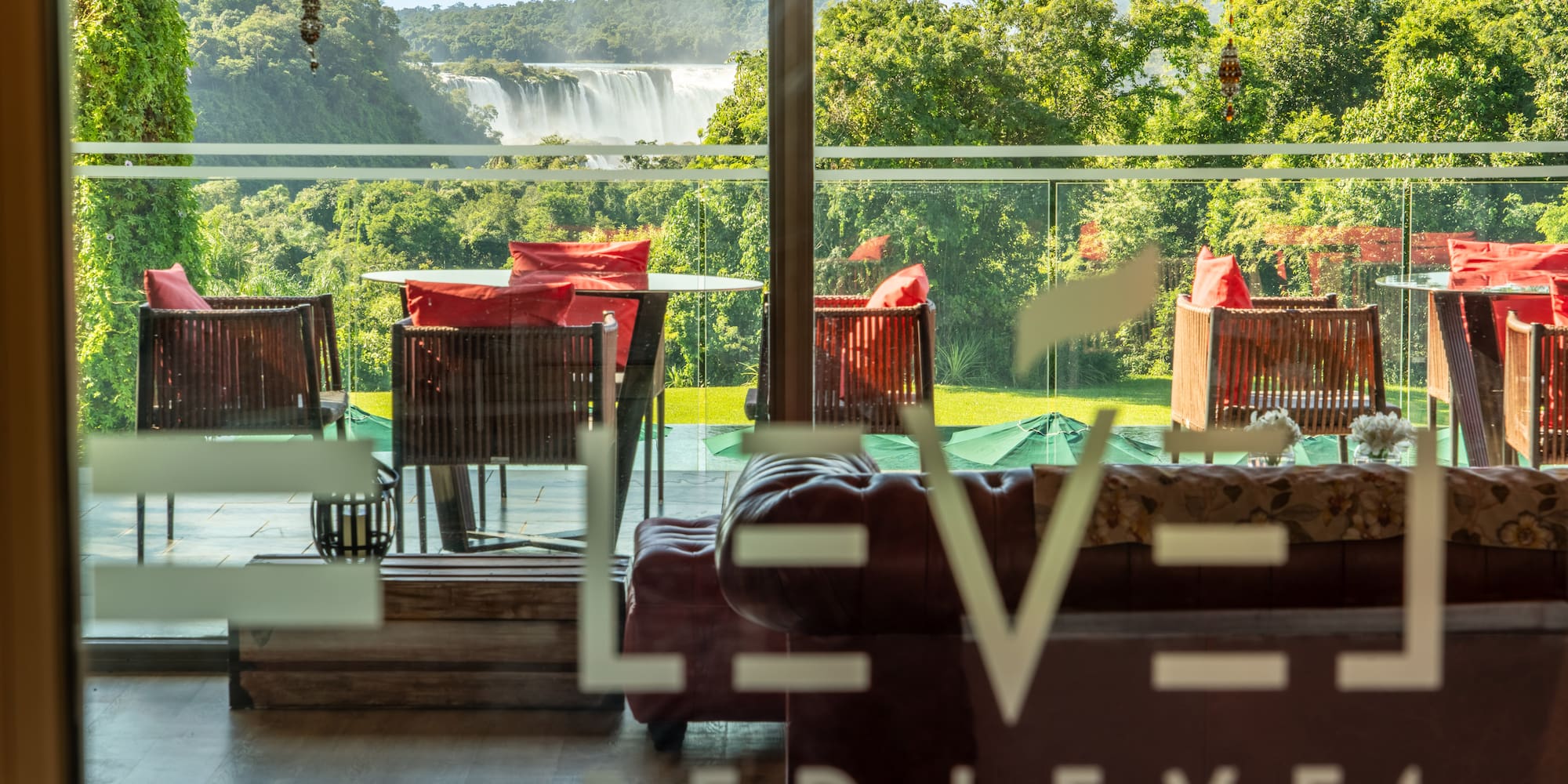a room with red couches and chairs