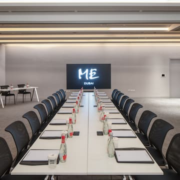 a conference room with a large screen