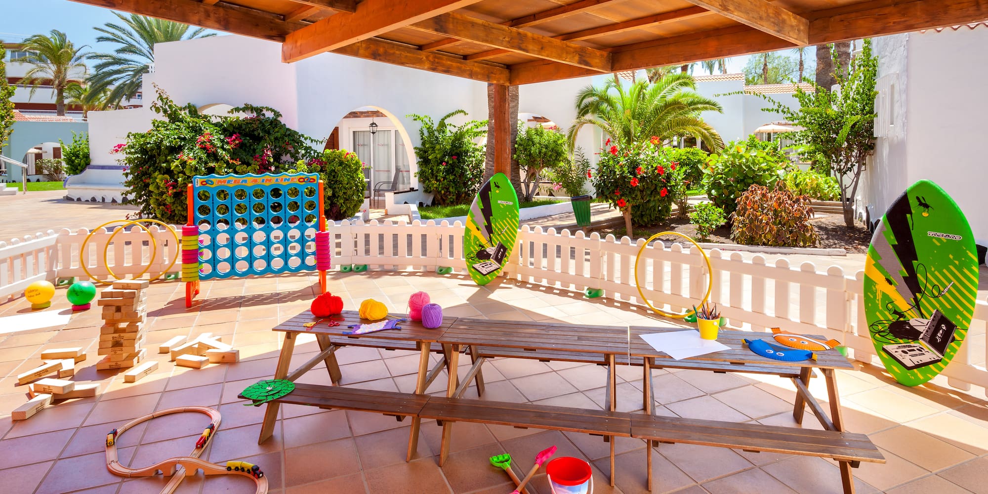 a picnic table with toys on a patio