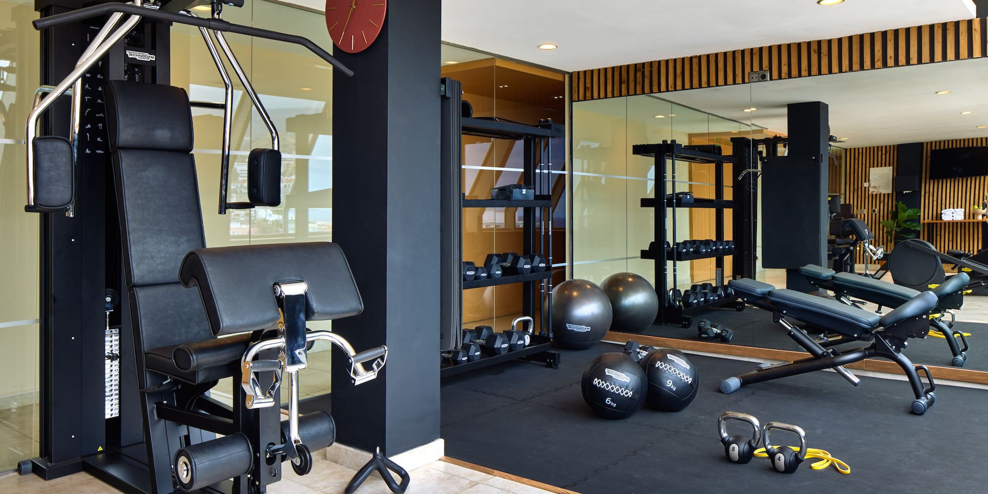 a gym with exercise equipment and exercise balls