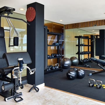 a gym with exercise equipment and exercise balls