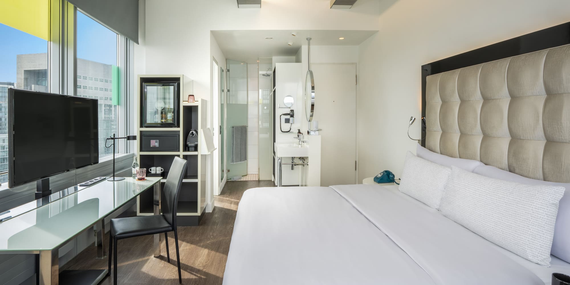 a room with a bed and a desk