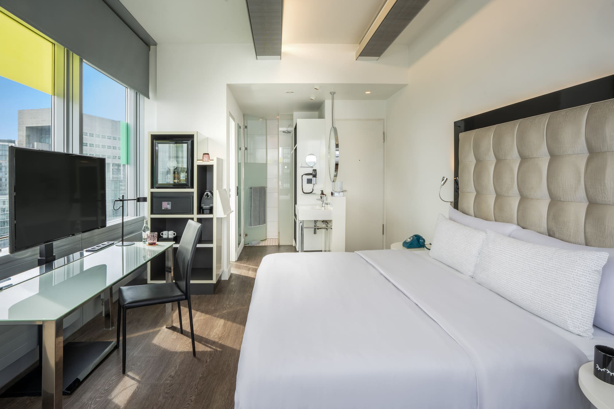 a room with a bed and a desk