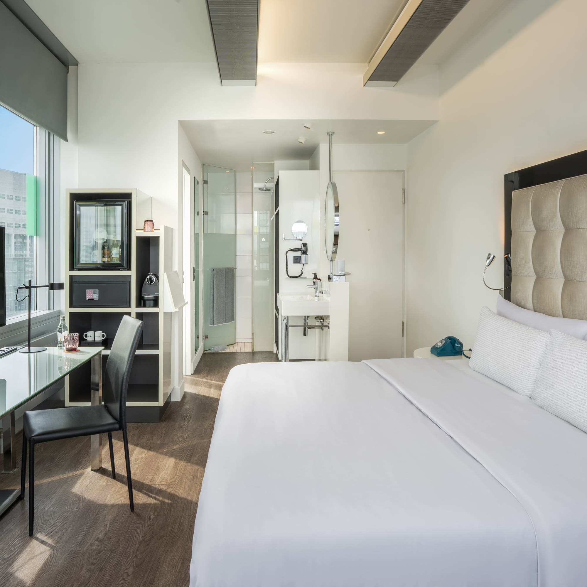 a room with a bed and a desk