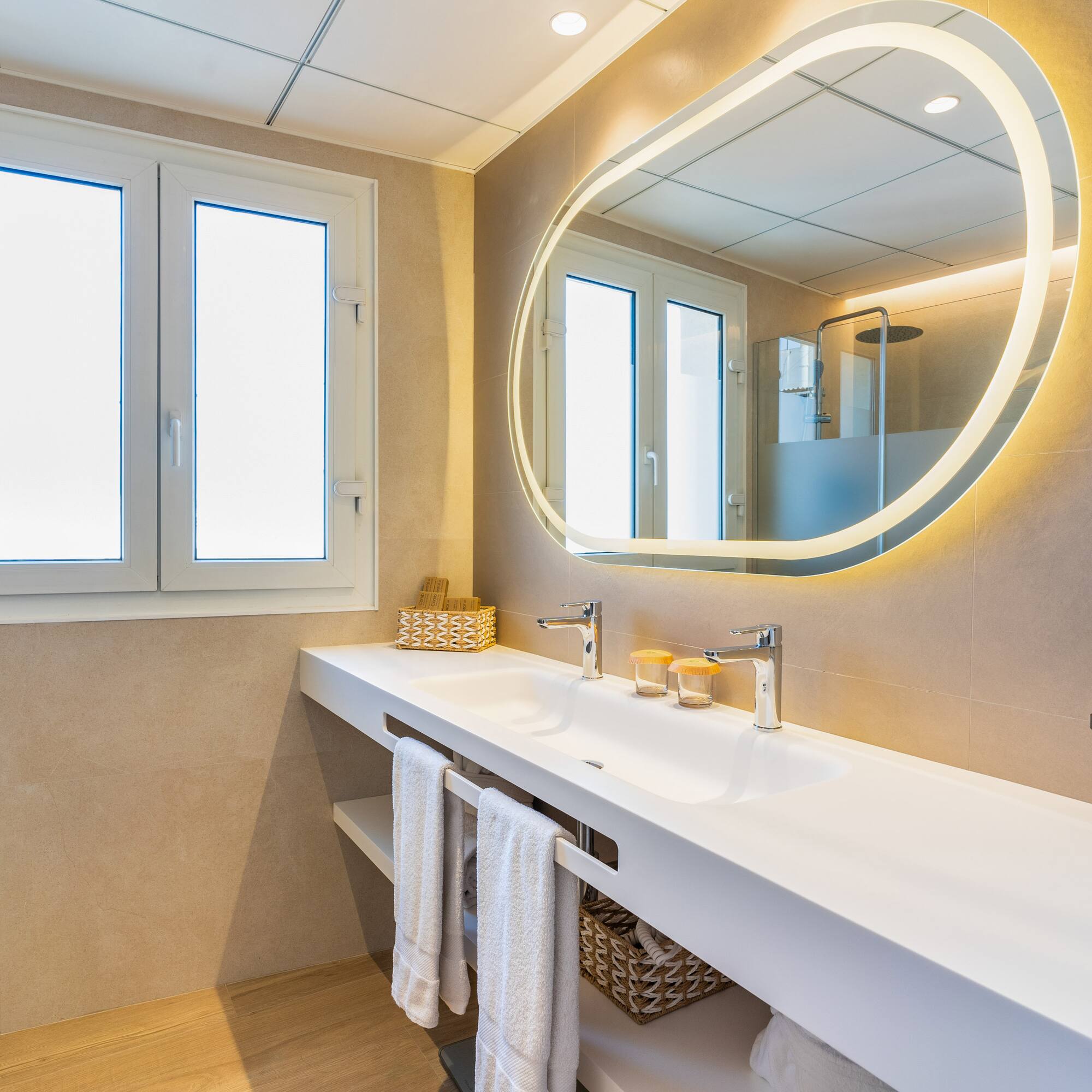 a bathroom with a large round mirror