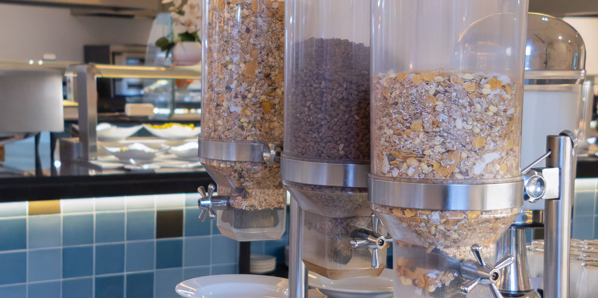 a group of cereals in containers on a table