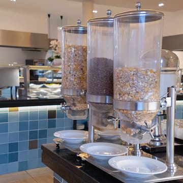 a group of cereals in containers on a table