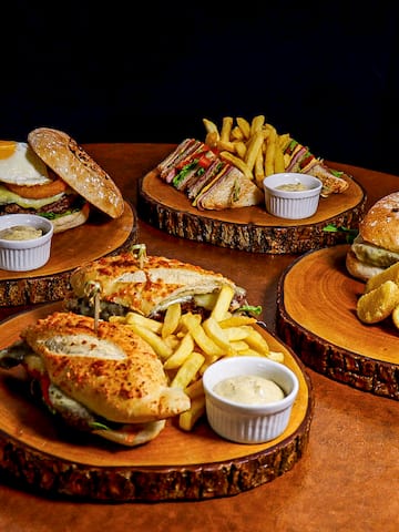 a group of wooden plates with food on them