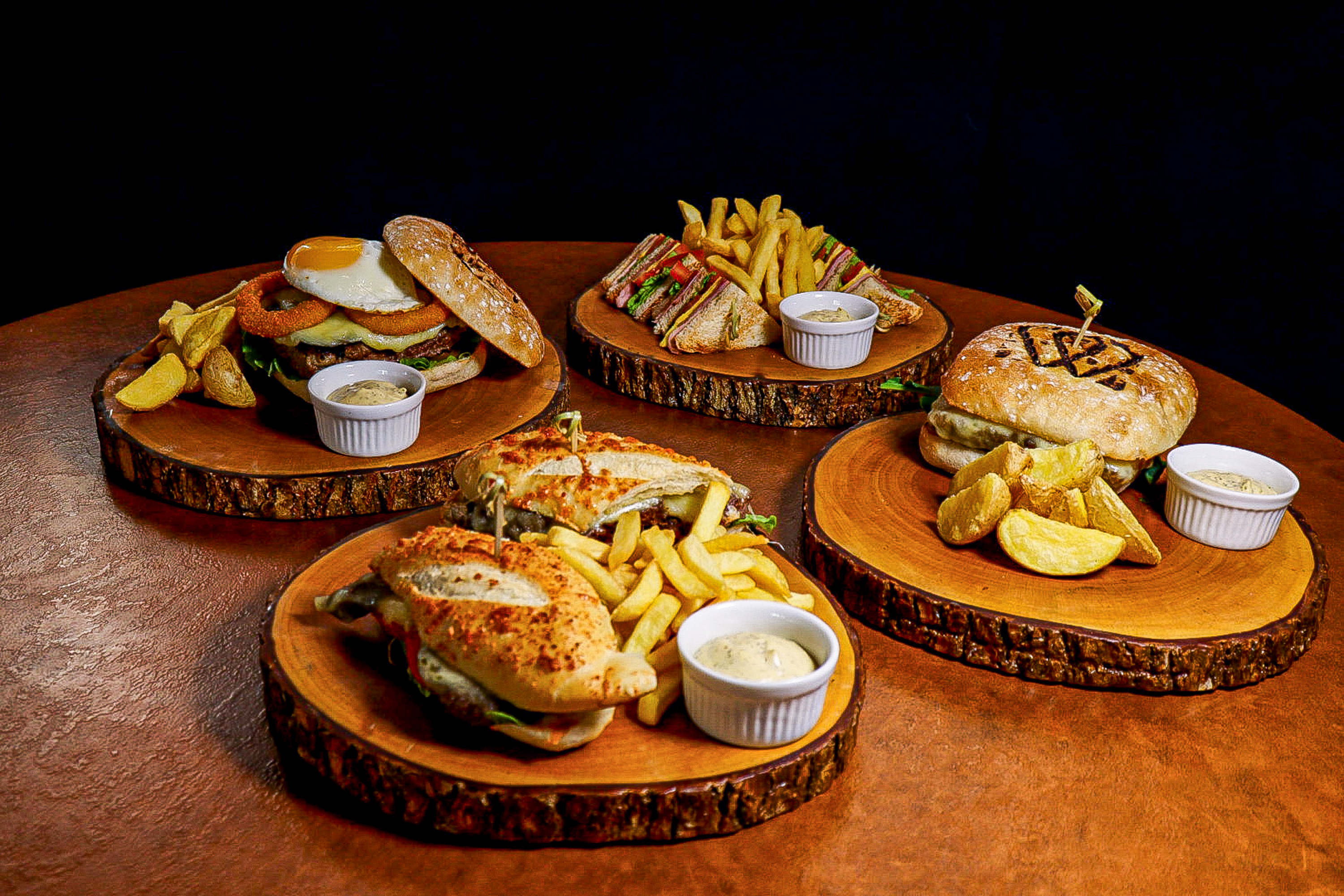a group of wooden plates with food on them